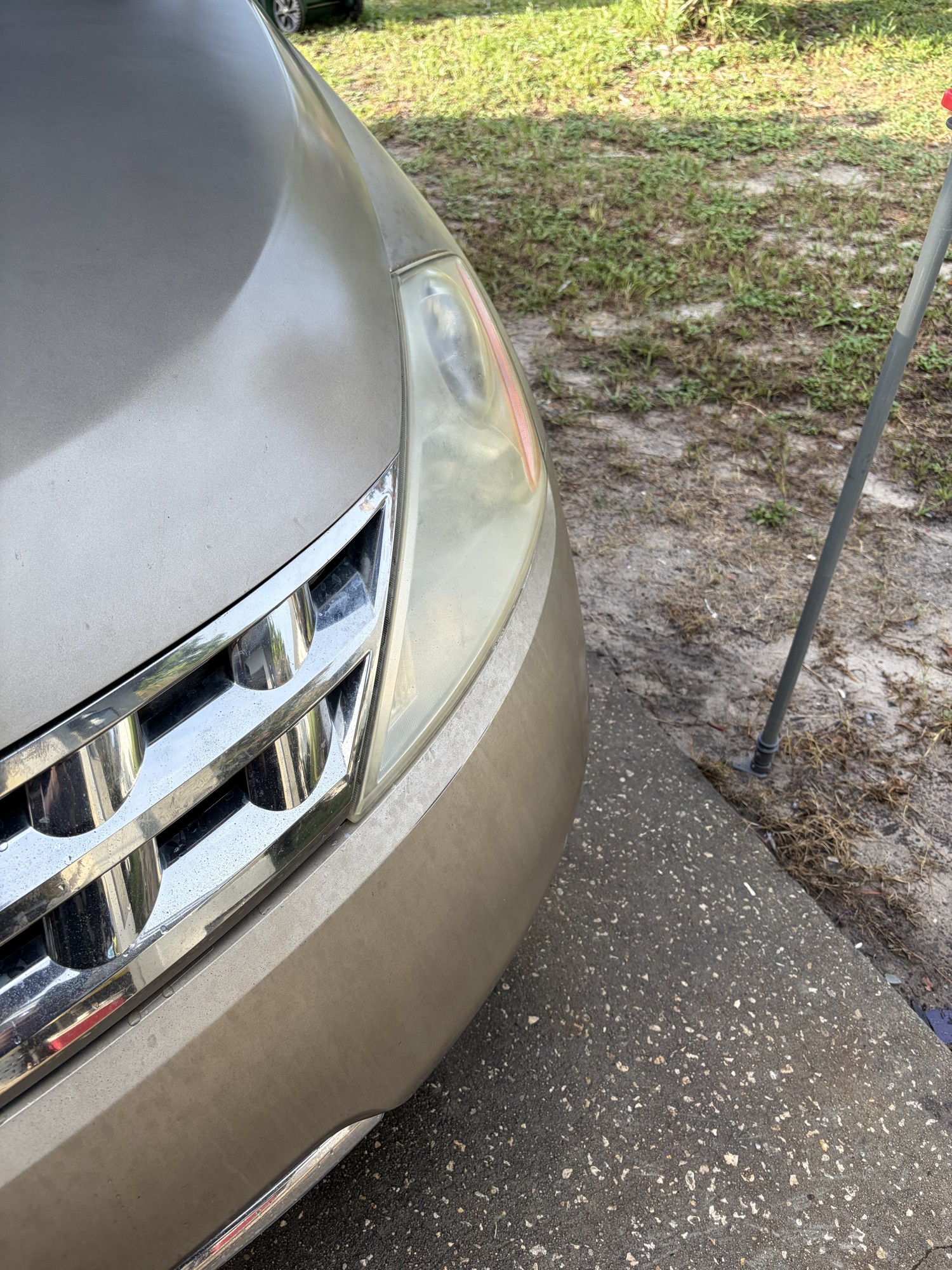 Foggy yellowed headlight before restoration